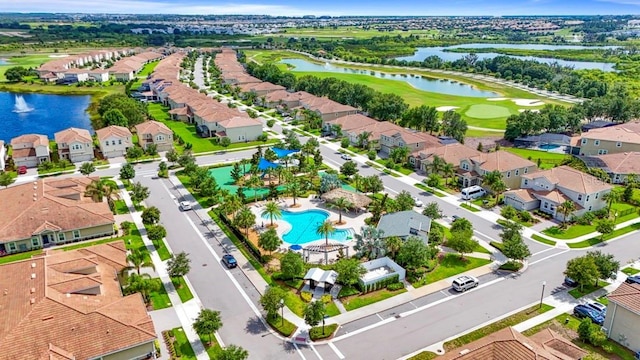 877 Ocean Course Ave, Davenport, FL 33896 - aerial view of residential area with a large body of water, a pool, and a local golf course