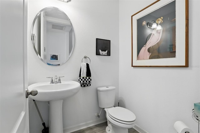 439 Windmill Palm Cir, Altamonte Springs, FL 32701 - half bathroom with toilet, wood finished floors, baseboards, and a sink
