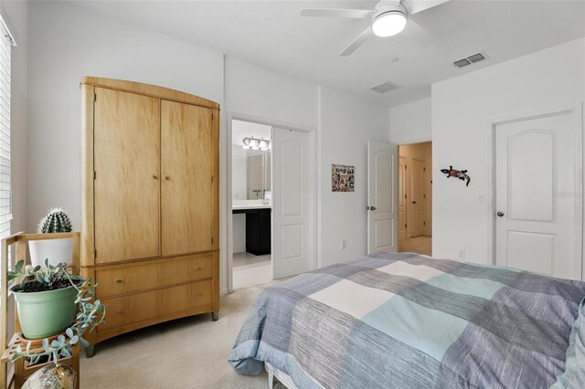 439 Windmill Palm Cir, Altamonte Springs, FL 32701 - bedroom with light carpet, connected bathroom, and a ceiling fan