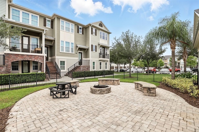 439 Windmill Palm Cir, Altamonte Springs, FL 32701 - view of property's community featuring a fire pit, stairway, a residential view, and a patio