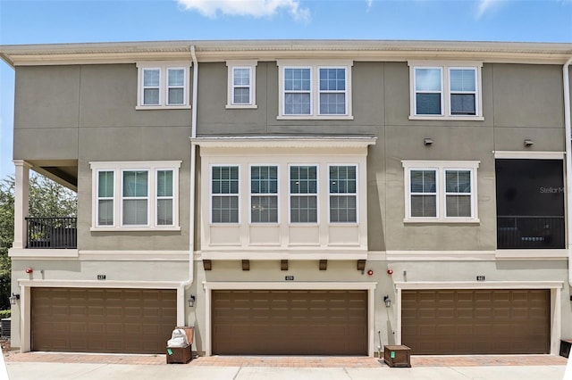 439 Windmill Palm Cir, Altamonte Springs, FL 32701 - view of front of property with an attached garage and stucco siding
