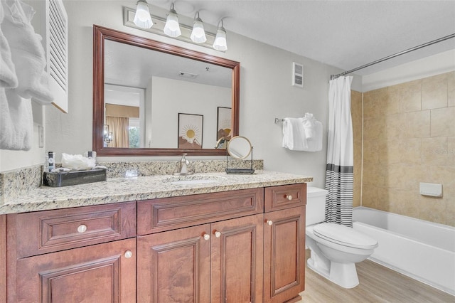 6337 Parc Corniche Dr Unit 2312, Orlando, FL 32821 - full bathroom with vanity, wood finished floors, and shower / tub combo