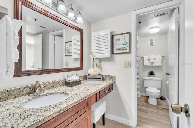6337 Parc Corniche Dr Unit 2312, Orlando, FL 32821 - bathroom with vanity and wood finished floors