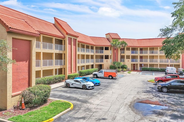 6337 Parc Corniche Dr Unit 2312, Orlando, FL 32821 - view of apartment building / complex with uncovered parking