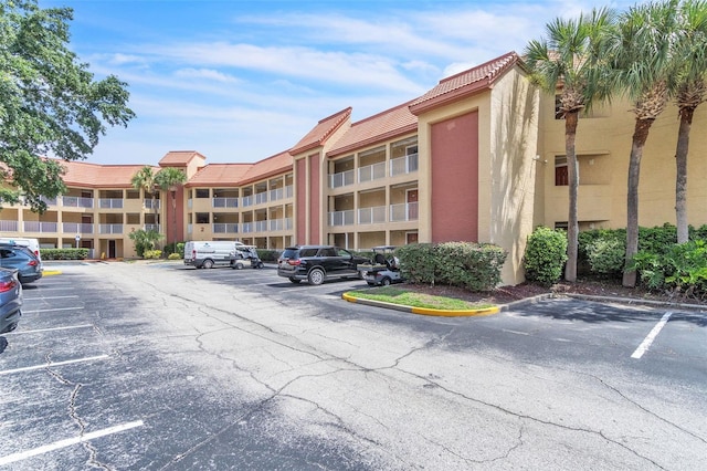 6337 Parc Corniche Dr Unit 2312, Orlando, FL 32821 - view of apartment building / complex featuring uncovered parking