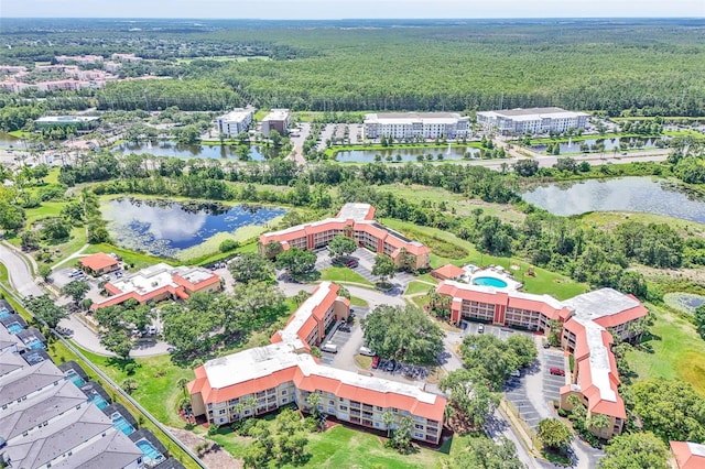 6337 Parc Corniche Dr Unit 2312, Orlando, FL 32821 - aerial view of property and surrounding area featuring a forest and a large body of water