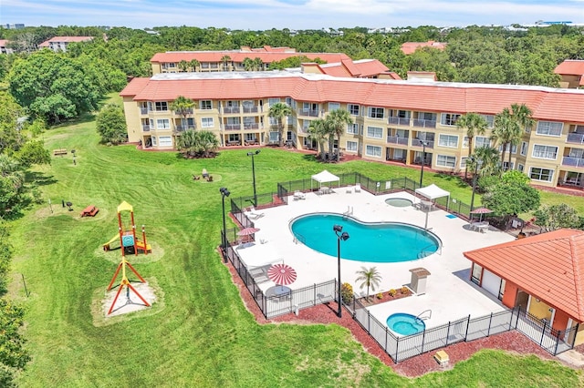 6337 Parc Corniche Dr Unit 2312, Orlando, FL 32821 - community pool featuring a patio