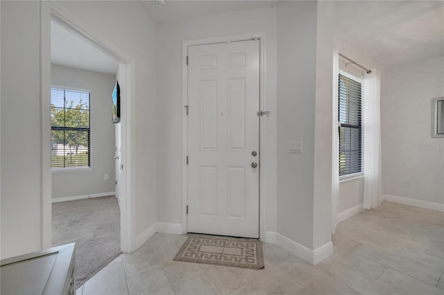 921 Costa Mesa Ln, Kissimmee, FL 34744 - foyer entrance featuring light tile patterned flooring and baseboards