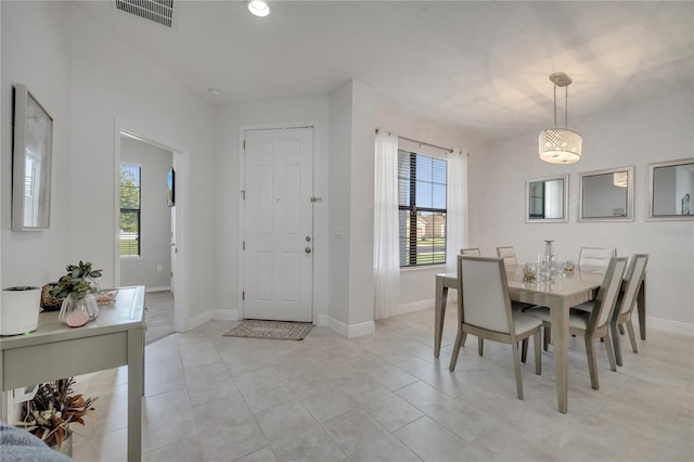 921 Costa Mesa Ln, Kissimmee, FL 34744 - dining room featuring healthy amount of natural light, baseboards, and light tile patterned floors