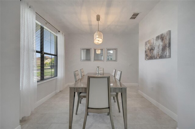 921 Costa Mesa Ln, Kissimmee, FL 34744 - dining space with baseboards and light tile patterned flooring