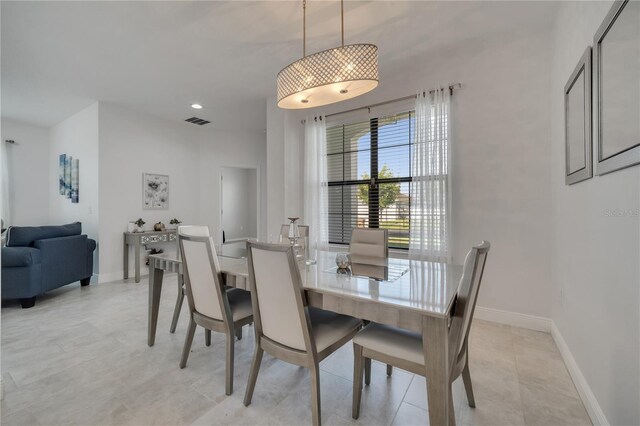 921 Costa Mesa Ln, Kissimmee, FL 34744 - dining area featuring baseboards