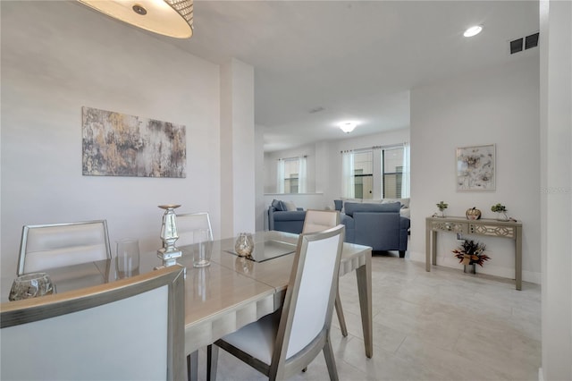 921 Costa Mesa Ln, Kissimmee, FL 34744 - dining area featuring baseboards, light tile patterned flooring, and recessed lighting