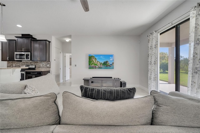 921 Costa Mesa Ln, Kissimmee, FL 34744 - living area featuring baseboards and recessed lighting