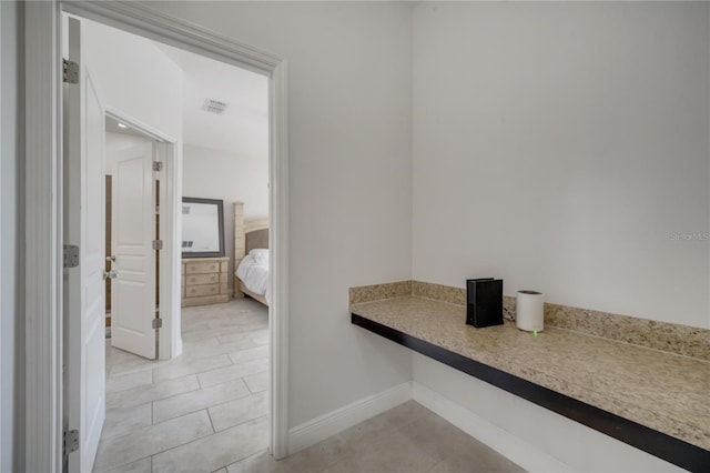 921 Costa Mesa Ln, Kissimmee, FL 34744 - hallway with baseboards and light tile patterned floors