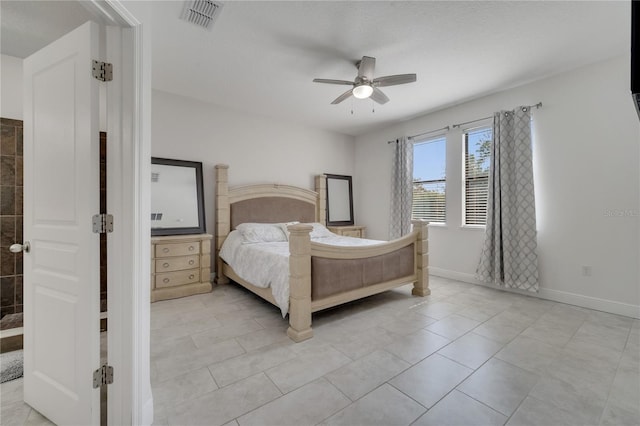 921 Costa Mesa Ln, Kissimmee, FL 34744 - bedroom with ceiling fan, baseboards, and light tile patterned floors