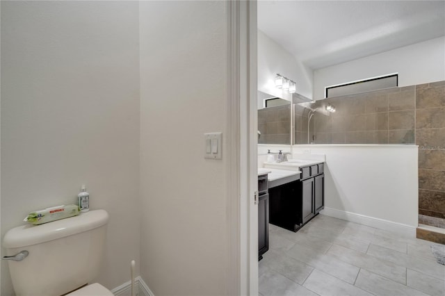 921 Costa Mesa Ln, Kissimmee, FL 34744 - bathroom with vanity, a walk in shower, tile patterned flooring, and toilet