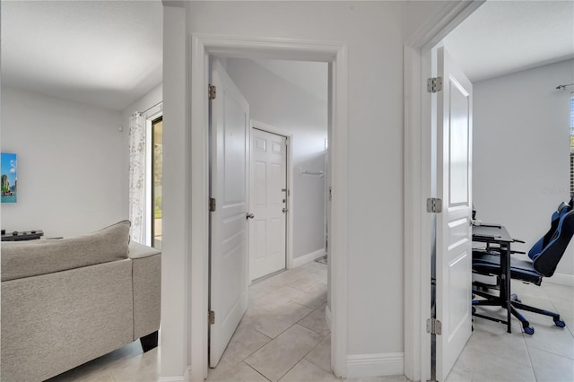 921 Costa Mesa Ln, Kissimmee, FL 34744 - hall featuring light tile patterned floors and baseboards