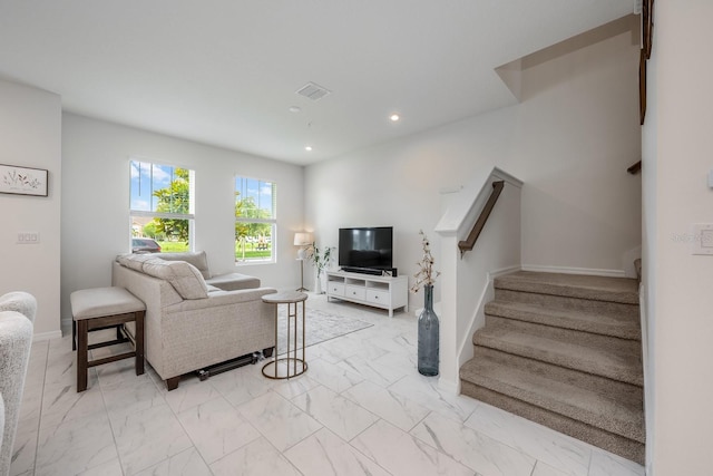 10221 Highline Crest St, Orlando, FL 32832 - living room with stairway, light marble finish flooring, recessed lighting, and baseboards