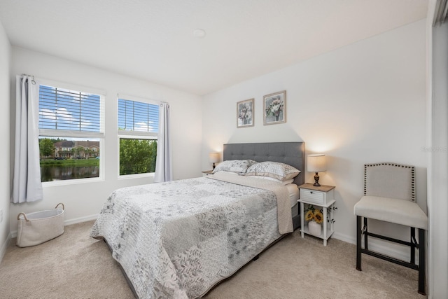 10221 Highline Crest St, Orlando, FL 32832 - bedroom featuring light carpet and baseboards