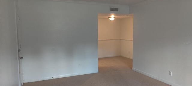315 Wymore Rd Unit 104, Altamonte Springs, FL 32714 - unfurnished room featuring carpet floors, baseboards, and ornamental molding