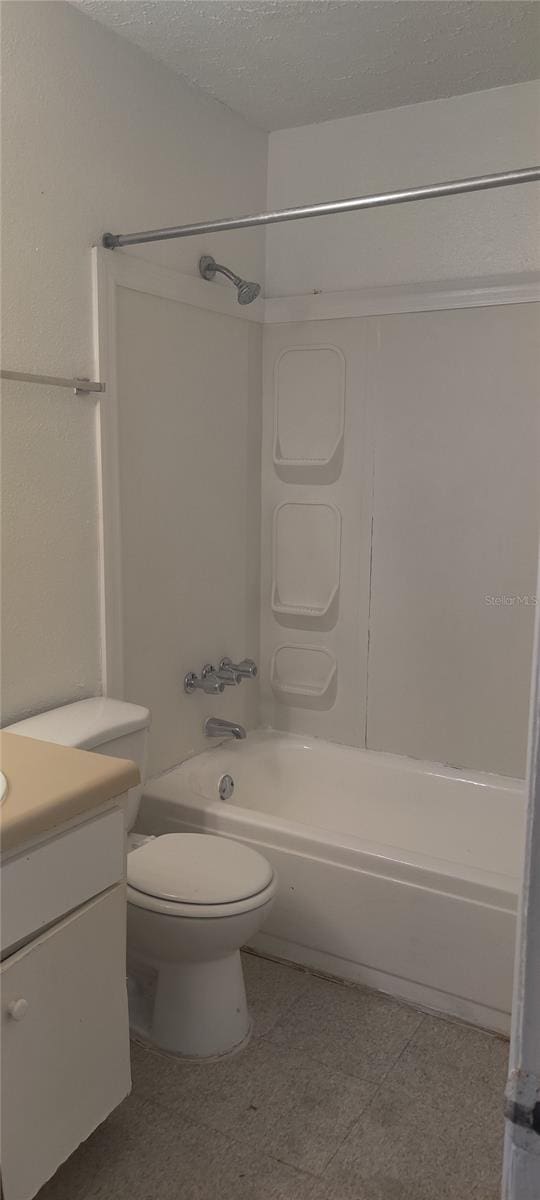 315 Wymore Rd Unit 104, Altamonte Springs, FL 32714 - bathroom with bathing tub / shower combination, vanity, toilet, and a textured ceiling