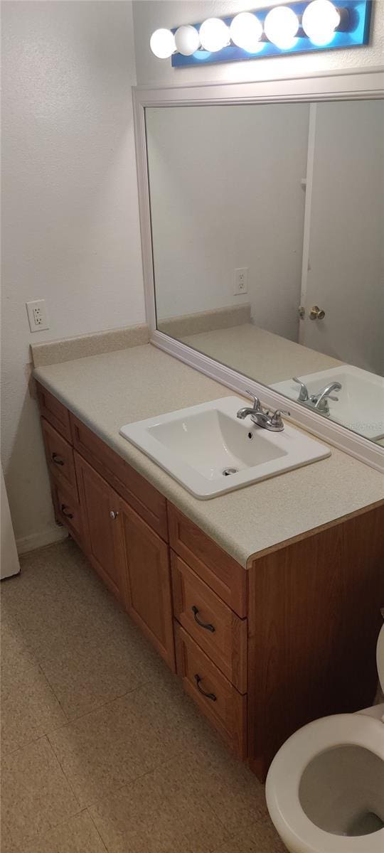 315 Wymore Rd Unit 104, Altamonte Springs, FL 32714 - half bath with vanity, tile patterned floors, and toilet