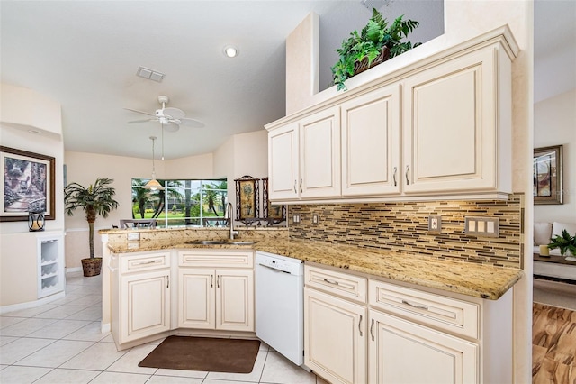 2135 Springwater Ln, Port Orange, FL 32128 - kitchen with dishwasher, a sink, a peninsula, backsplash, and a ceiling fan