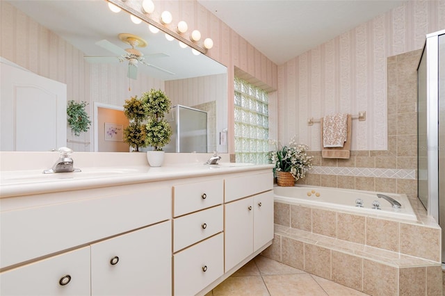 2135 Springwater Ln, Port Orange, FL 32128 - bathroom featuring wallpapered walls, double vanity, a stall shower, tile patterned flooring, and a garden tub
