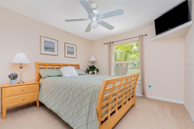 2135 Springwater Ln, Port Orange, FL 32128 - bedroom featuring light colored carpet, baseboards, and a ceiling fan