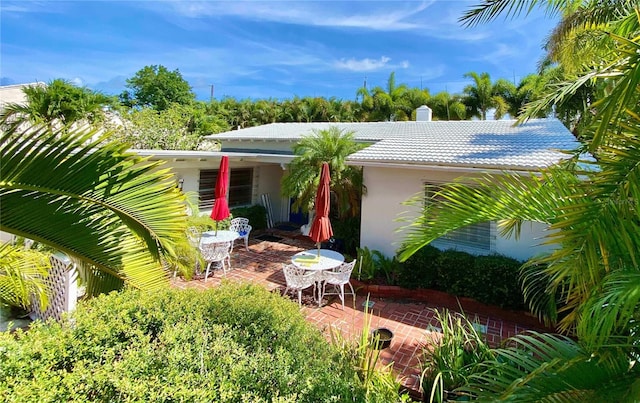 16107 Gulf Blvd, Redington Beach, FL 33708 - back of property with a patio area, stucco siding, and a tile roof