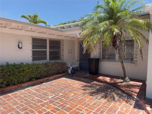 16107 Gulf Blvd, Redington Beach, FL 33708 - entrance to property with stucco siding and a patio