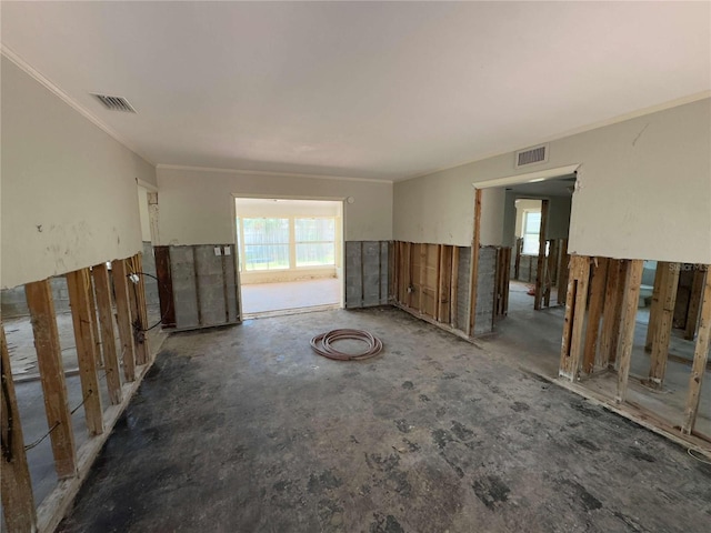 16107 Gulf Blvd, Redington Beach, FL 33708 - empty room with healthy amount of natural light and ornamental molding