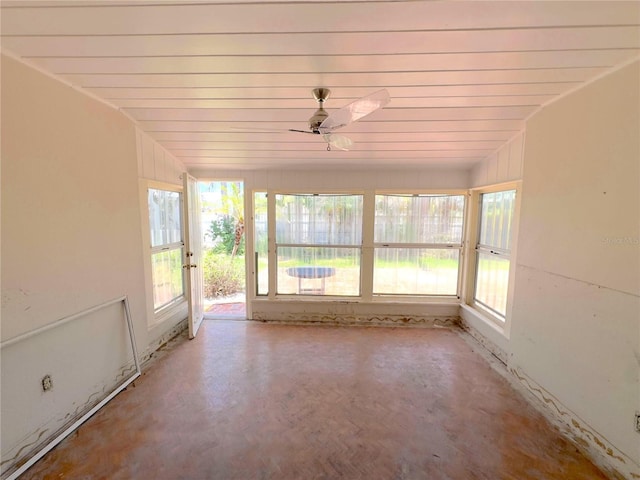 16107 Gulf Blvd, Redington Beach, FL 33708 - unfurnished sunroom featuring healthy amount of natural light and concrete floors