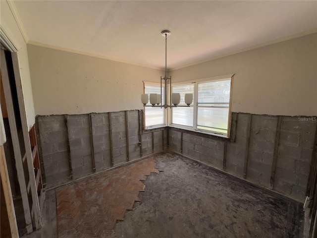 16107 Gulf Blvd, Redington Beach, FL 33708 - unfurnished dining area featuring crown molding and a chandelier
