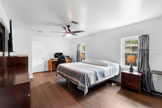 1805 Paloma Ave, Sanford, FL 32771 - bedroom with a textured ceiling, wood finished floors, multiple windows, and a desk