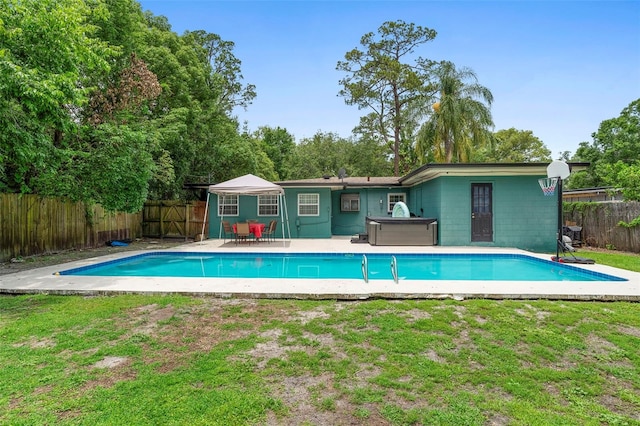 1805 Paloma Ave, Sanford, FL 32771 - view of swimming pool featuring a fenced backyard, a patio, and a hot tub