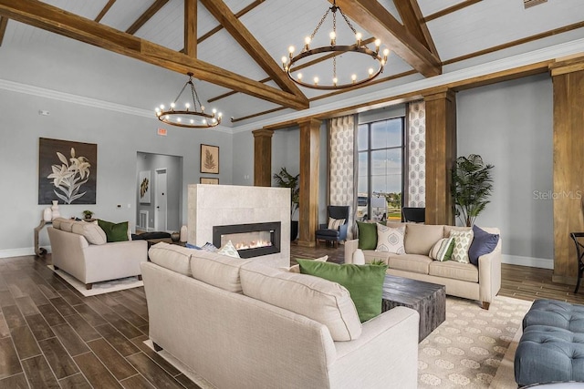 6615 Leo Ln, Saint Cloud, FL 34773 - living area featuring a chandelier, beam ceiling, baseboards, a tile fireplace, and high vaulted ceiling