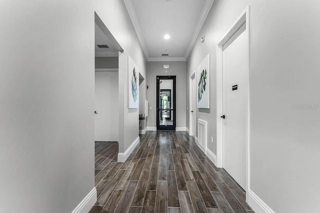 6615 Leo Ln, Saint Cloud, FL 34773 - entrance foyer featuring dark wood finished floors, baseboards, and ornamental molding
