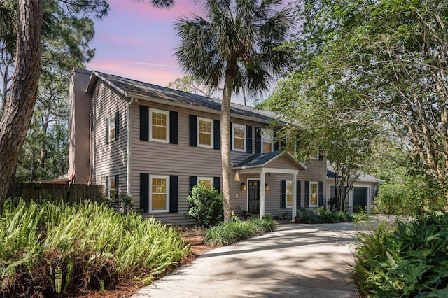 6321 Quarterhorse Cir, Cocoa, FL 32926 - colonial-style house featuring driveway and a chimney