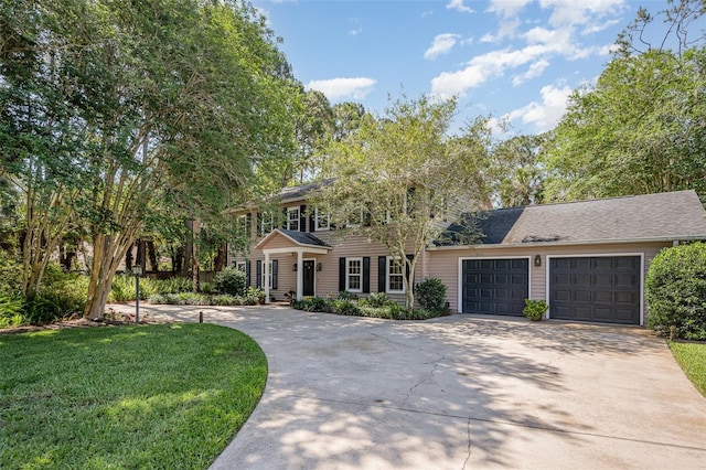 6321 Quarterhorse Cir, Cocoa, FL 32926 - colonial house with concrete driveway, a front yard, and an attached garage