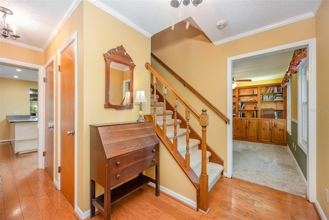 6321 Quarterhorse Cir, Cocoa, FL 32926 - stairway with hardwood / wood-style floors, a textured ceiling, crown molding, baseboards, and a ceiling fan