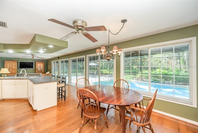 6321 Quarterhorse Cir, Cocoa, FL 32926 - dining area featuring ceiling fan, light wood-style flooring, and plenty of natural light