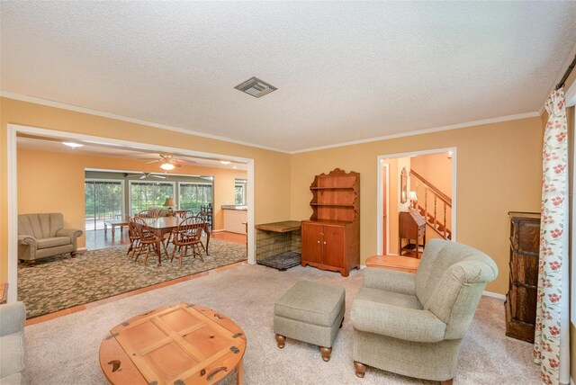 6321 Quarterhorse Cir, Cocoa, FL 32926 - carpeted living area with ornamental molding, a textured ceiling, stairs, and a ceiling fan