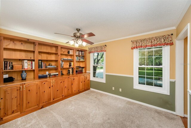 6321 Quarterhorse Cir, Cocoa, FL 32926 - carpeted spare room with a textured ceiling, a ceiling fan, crown molding, and baseboards