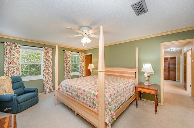 6321 Quarterhorse Cir, Cocoa, FL 32926 - bedroom featuring carpet floors, ornamental molding, a ceiling fan, and a textured ceiling