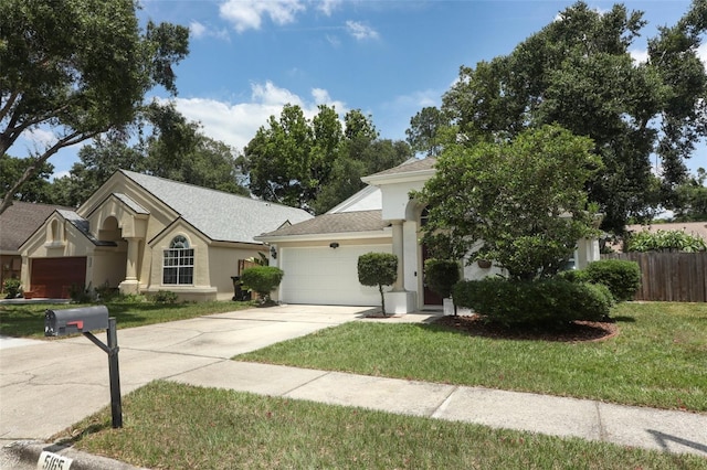 5165 Mystic Point Ct, Orlando, FL 32812 - view of front facade featuring concrete driveway, a garage, stucco siding, and a shingled roof