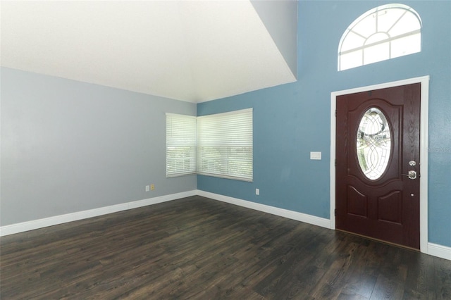 5165 Mystic Point Ct, Orlando, FL 32812 - foyer entrance with dark wood-style floors, a towering ceiling, and baseboards