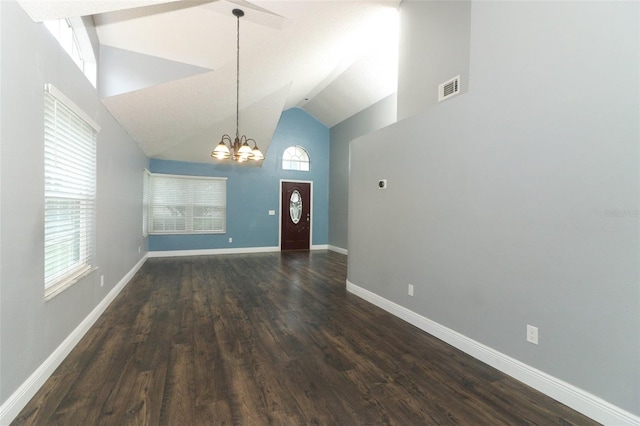 5165 Mystic Point Ct, Orlando, FL 32812 - foyer featuring a chandelier, dark wood-style floors, baseboards, and high vaulted ceiling