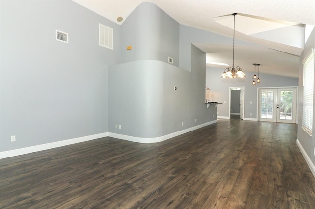 5165 Mystic Point Ct, Orlando, FL 32812 - unfurnished living room featuring a chandelier, dark wood finished floors, french doors, high vaulted ceiling, and baseboards