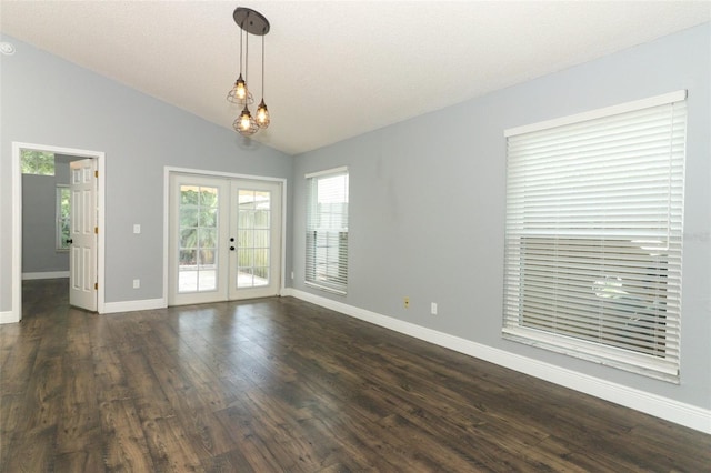 5165 Mystic Point Ct, Orlando, FL 32812 - spare room with french doors, baseboards, vaulted ceiling, dark wood-type flooring, and a chandelier